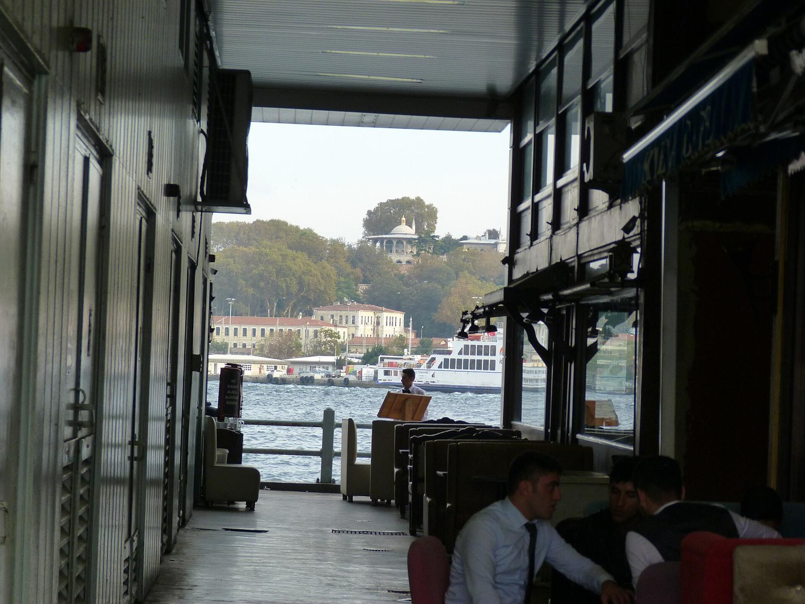 People Fishing on Gray Concrete Bridge
